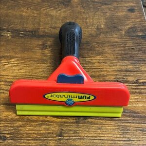 FURminator Dog De-shedding tool.  Your vacuum cleaner will thank you!